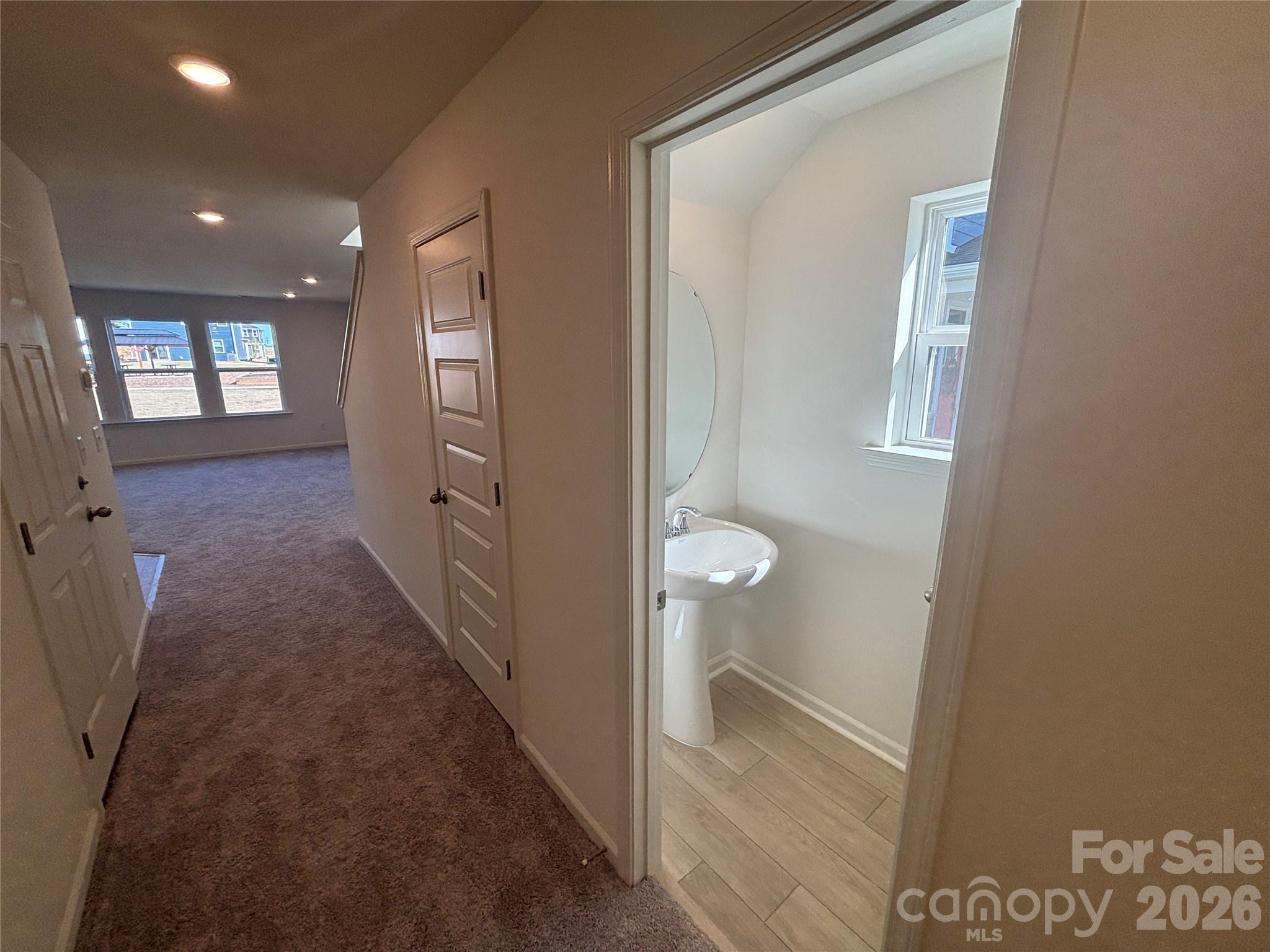 357 Roxanna Lane, Unit 72 York, SC 29745 - Photo 3 of 23 a view of a bathroom from a hallway