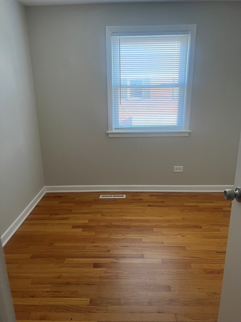 823 McHenry Road, Unit C Wheeling, IL 60090 - Photo 4 of 7 a view of a room with window
