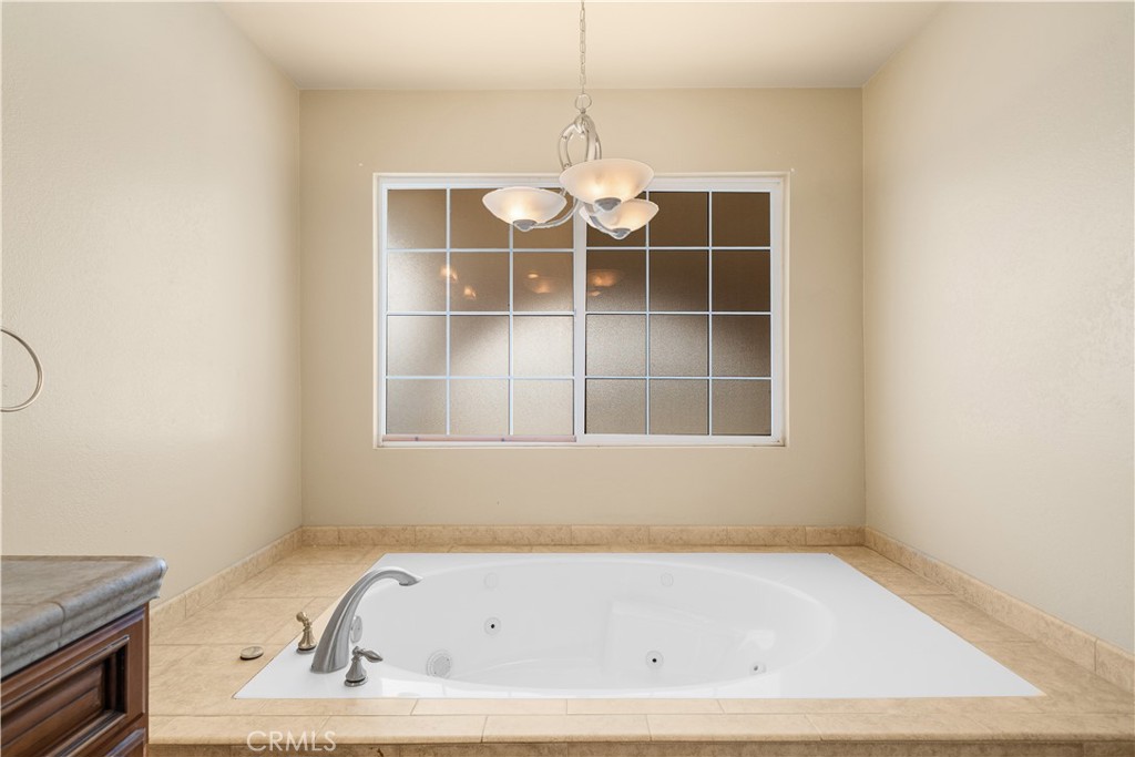 14433 Roy Rogers Road Oro Grande, CA 92368 - Photo 11 of 22 a bathroom with a bathtub and a window