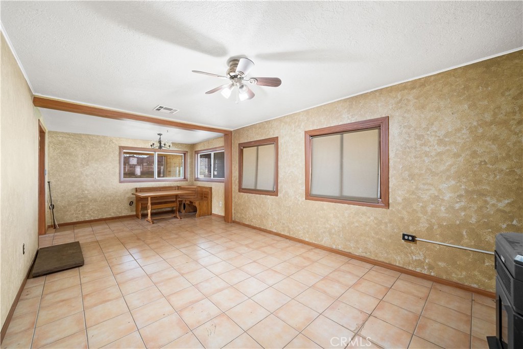 14433 Roy Rogers Road Oro Grande, CA 92368 - Photo 12 of 22 a view of a livingroom with furniture and ceiling fan