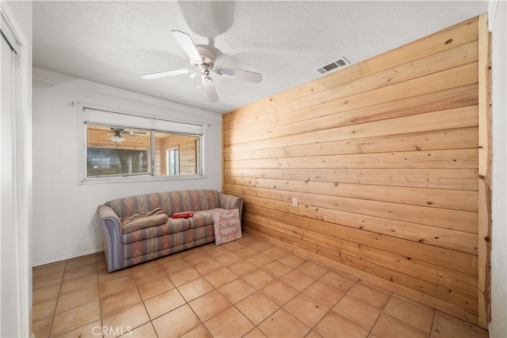 14433 Roy Rogers Road Oro Grande, CA 92368 - Photo 13 of 22 a living room with couches and chandelier
