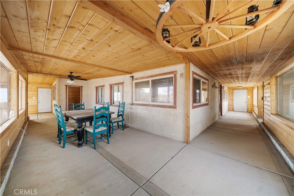 14433 Roy Rogers Road Oro Grande, CA 92368 - Photo 15 of 22 a view of a patio with table and chairs