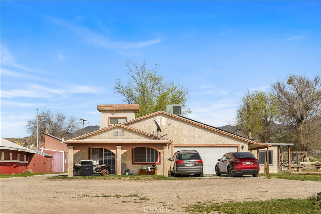 14433 Roy Rogers Road Oro Grande, CA 92368 - Photo 6 of 22 a car parked in front of house