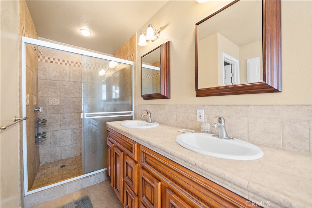 14433 Roy Rogers Road Oro Grande, CA 92368 - Photo 10 of 22 a bathroom with a sink and a mirror