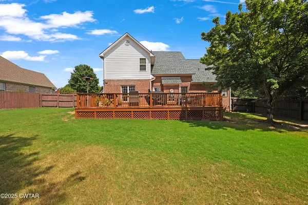 a front view of a house with a yard table and chairs