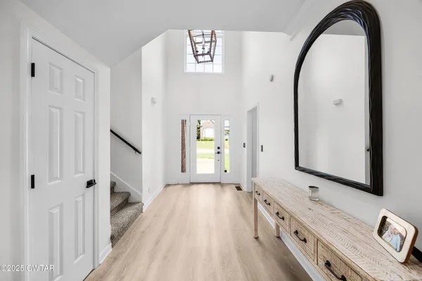 a view of a hallway view with staircase