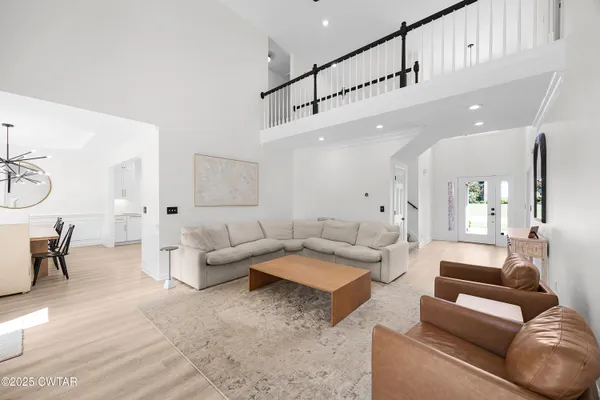 a living room with furniture and a table