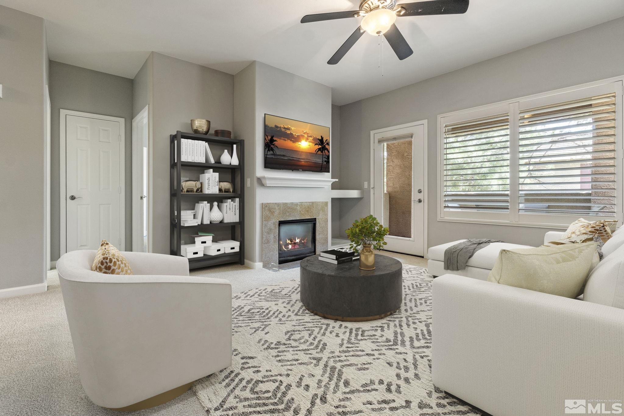 900 South Meadows Parkway, Unit 223 Reno, NV 89521 - Photo 11 of 40 a living room with furniture a fireplace and a flat screen tv