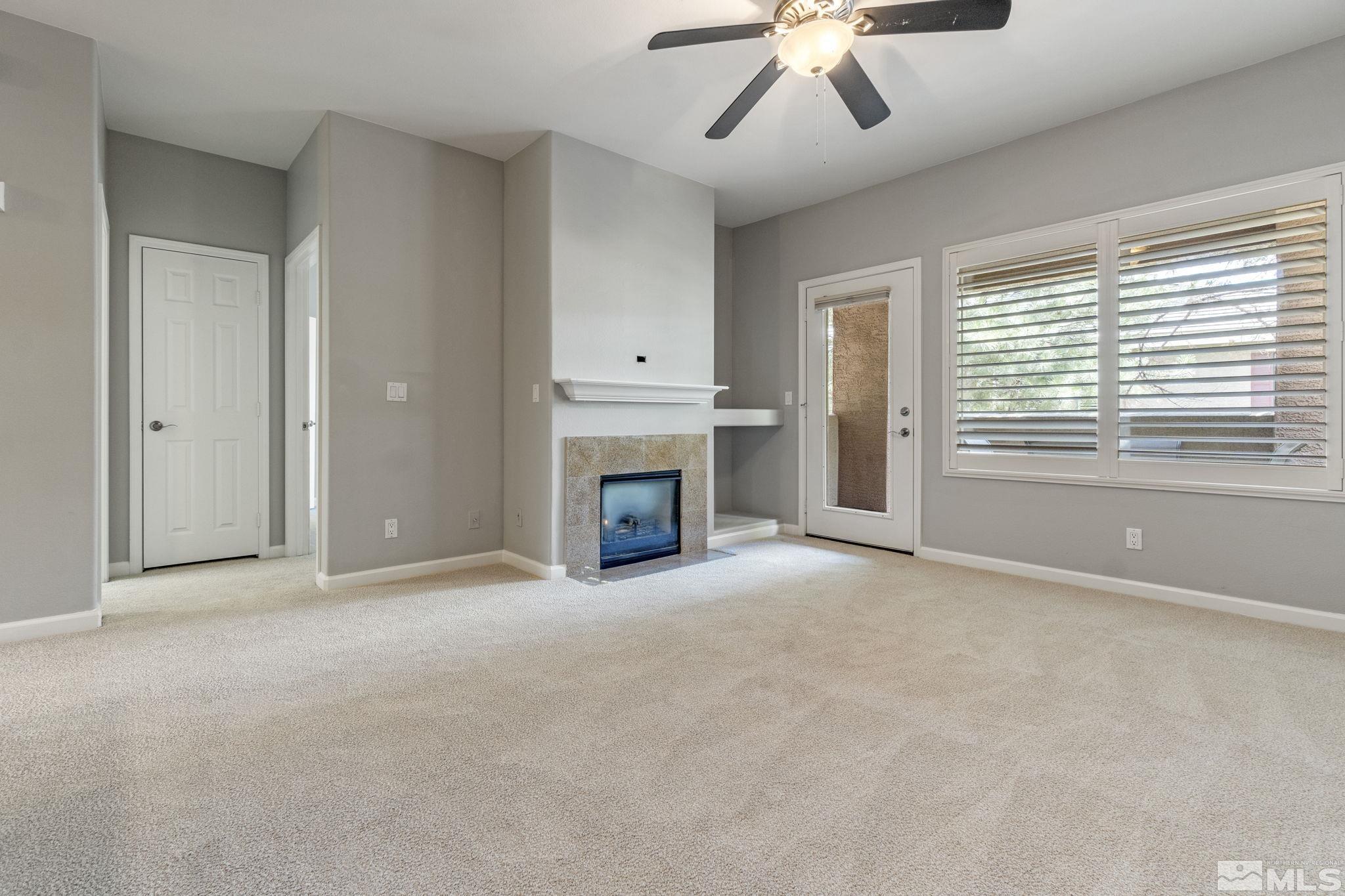 900 South Meadows Parkway, Unit 223 Reno, NV 89521 - Photo 12 of 40 a view of empty room with a fireplace