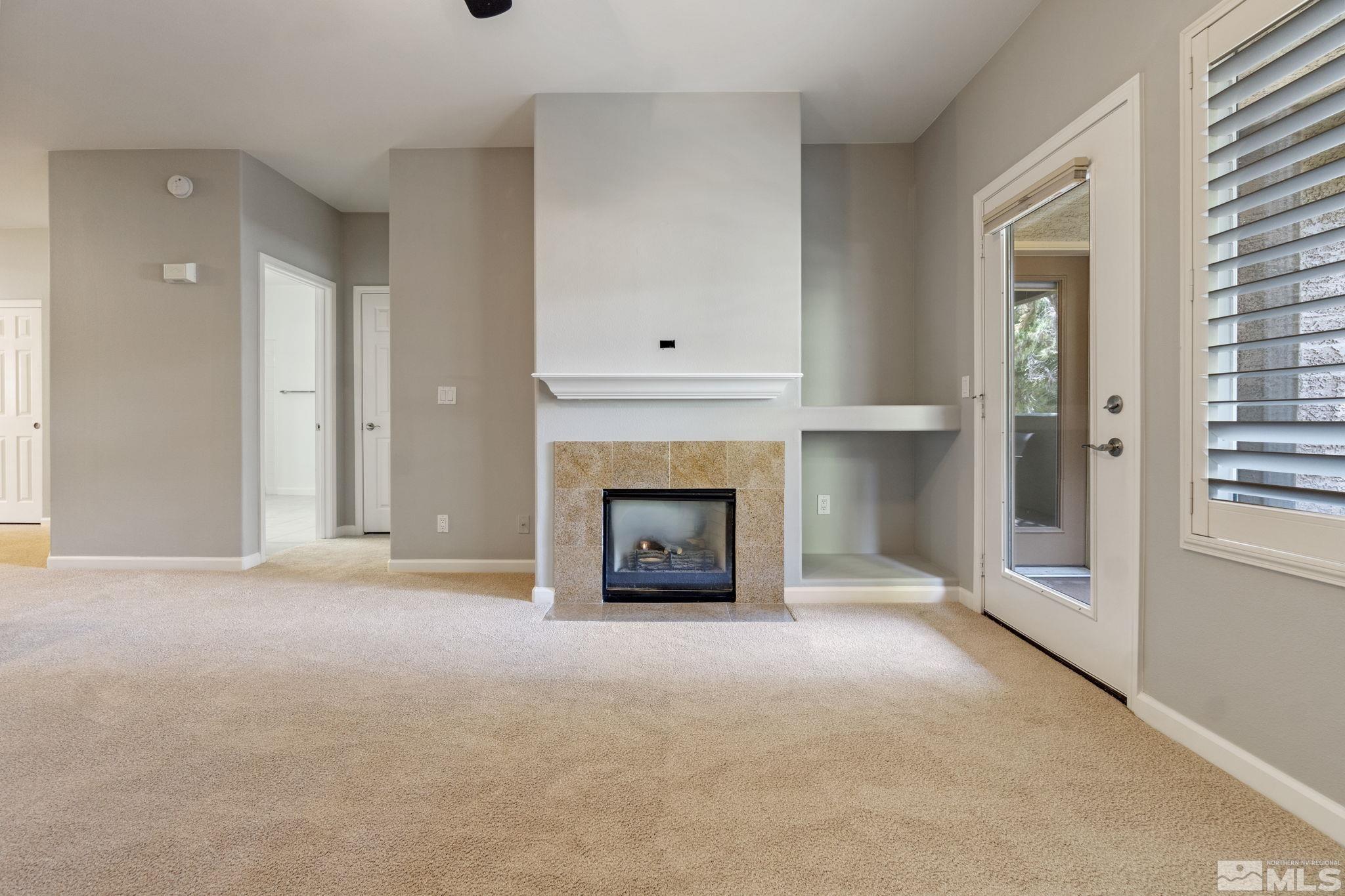 900 South Meadows Parkway, Unit 223 Reno, NV 89521 - Photo 13 of 40 a view of a livingroom with a fireplace