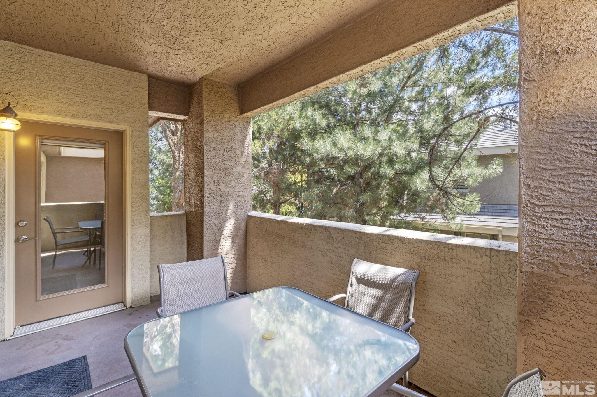 900 South Meadows Parkway, Unit 223 Reno, NV 89521 - Photo 15 of 40 view of living room with furniture and window