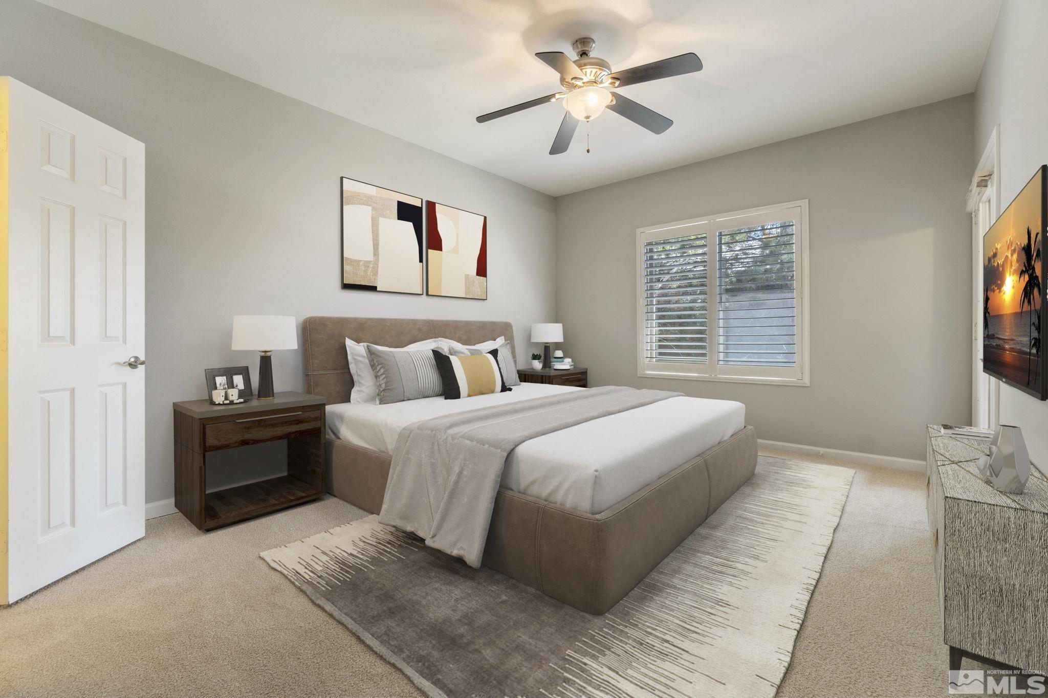 900 South Meadows Parkway, Unit 223 Reno, NV 89521 - Photo 16 of 40 a bedroom with a large bed and a window