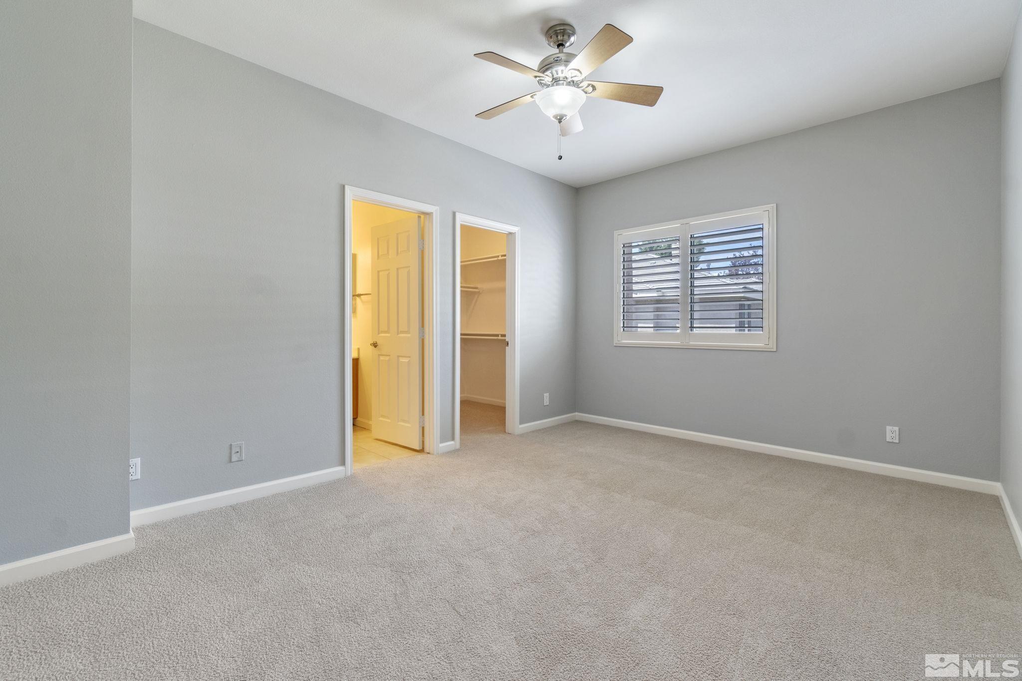 900 South Meadows Parkway, Unit 223 Reno, NV 89521 - Photo 22 of 40 an empty room with windows and closet