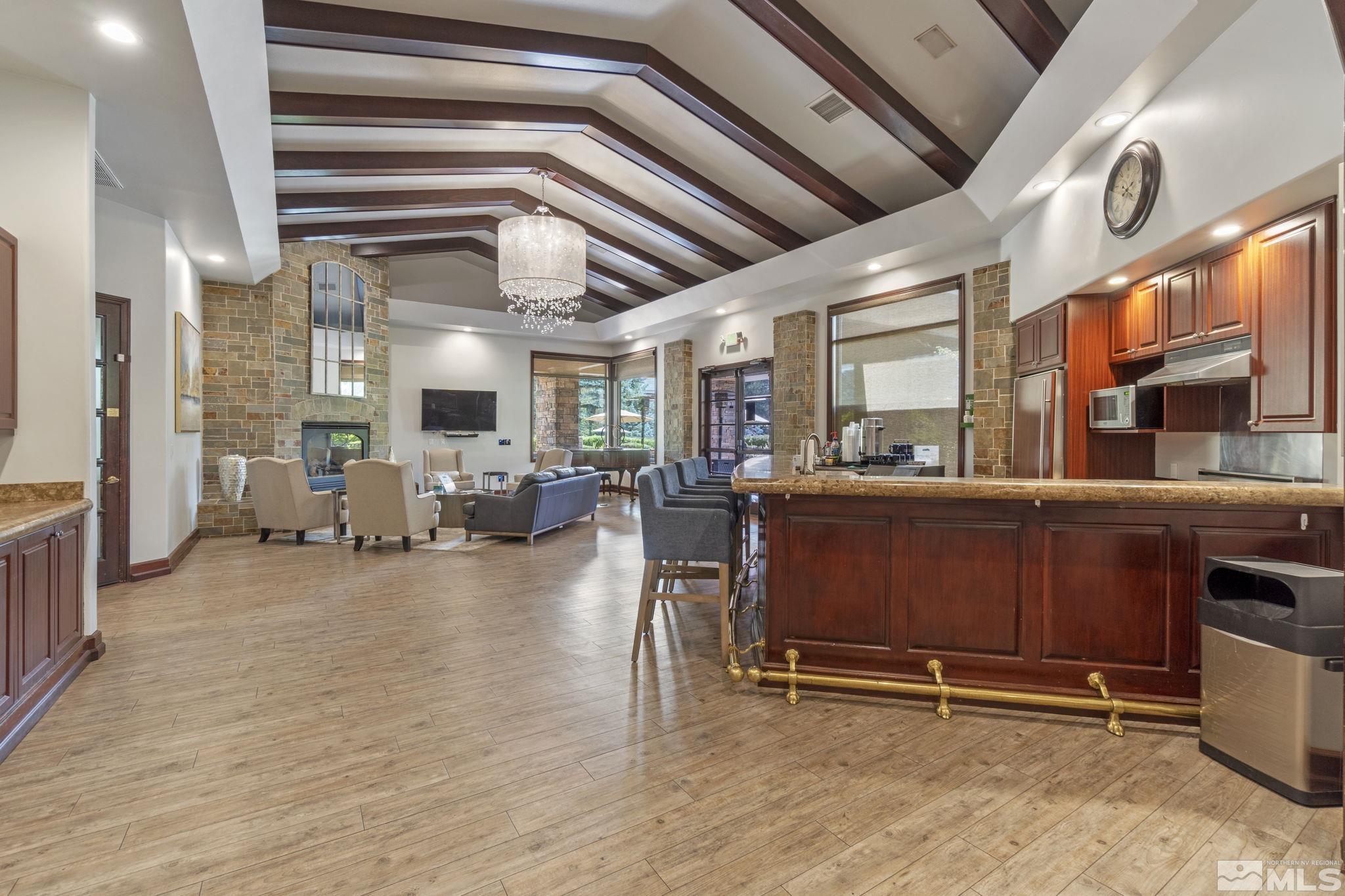 900 South Meadows Parkway, Unit 223 Reno, NV 89521 - Photo 30 of 40 a view of room with furniture and wooden floor