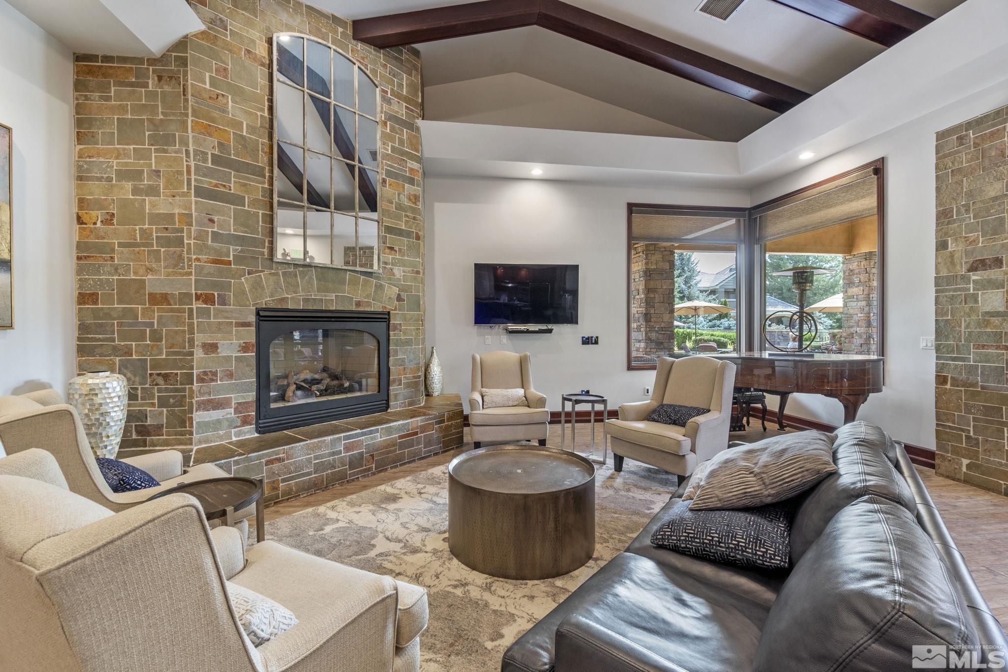 900 South Meadows Parkway, Unit 223 Reno, NV 89521 - Photo 32 of 40 a living room with furniture and a fireplace