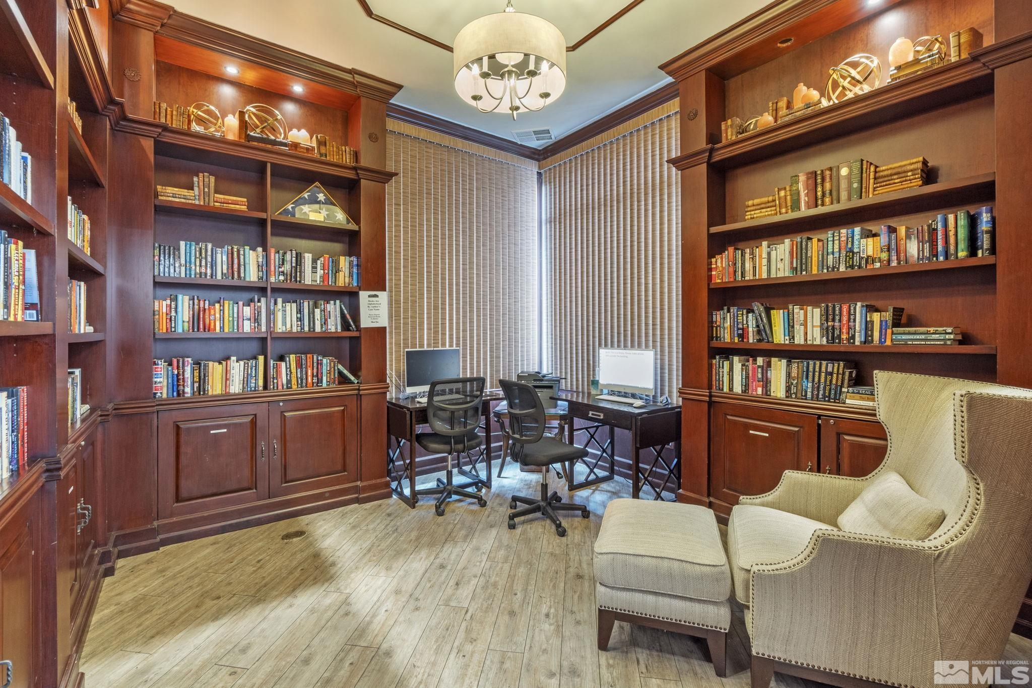 900 South Meadows Parkway, Unit 223 Reno, NV 89521 - Photo 33 of 40 a living room with furniture a bookshelf and a window
