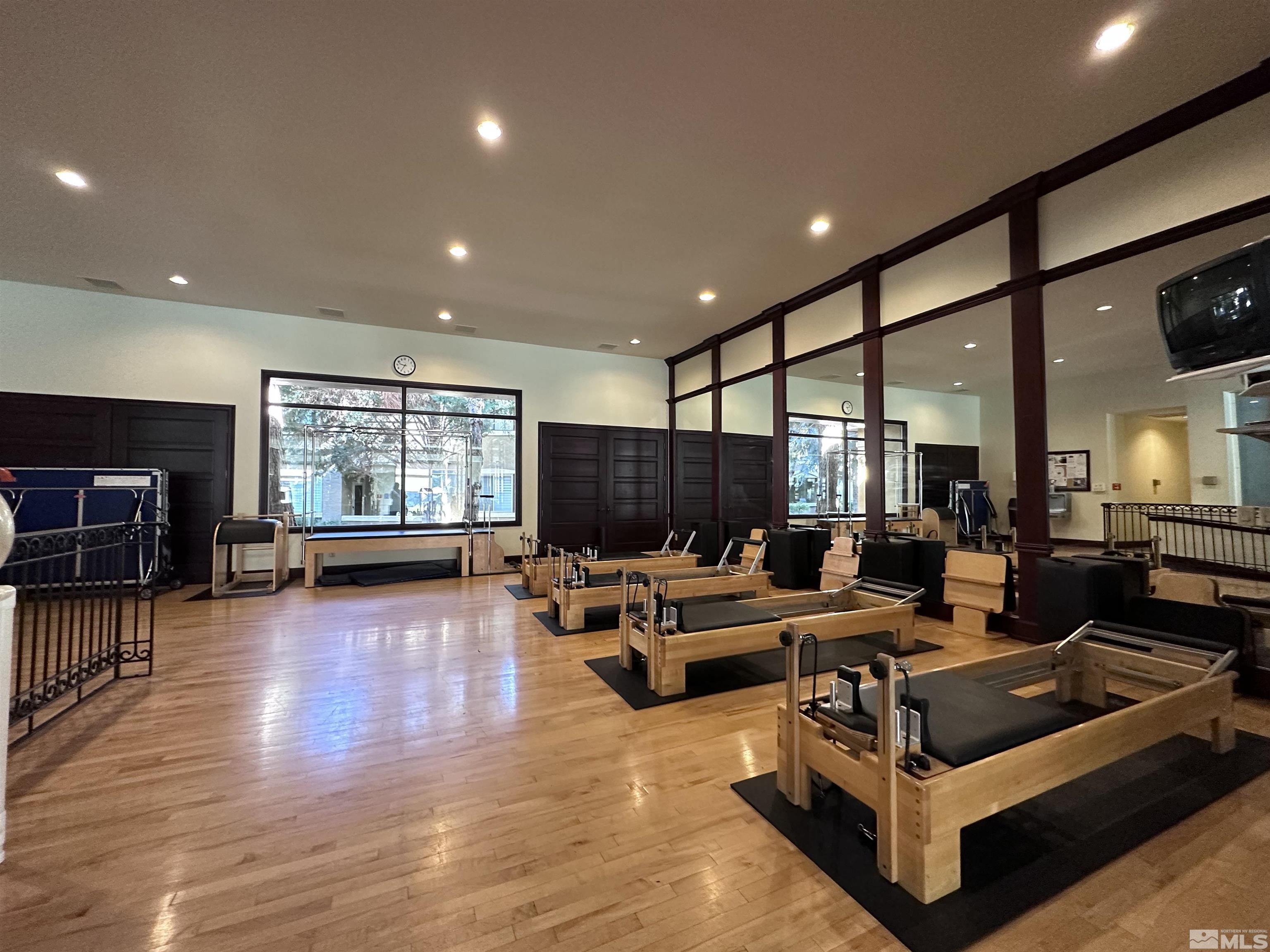 900 South Meadows Parkway, Unit 223 Reno, NV 89521 - Photo 35 of 40 a living room with furniture and a wooden floor