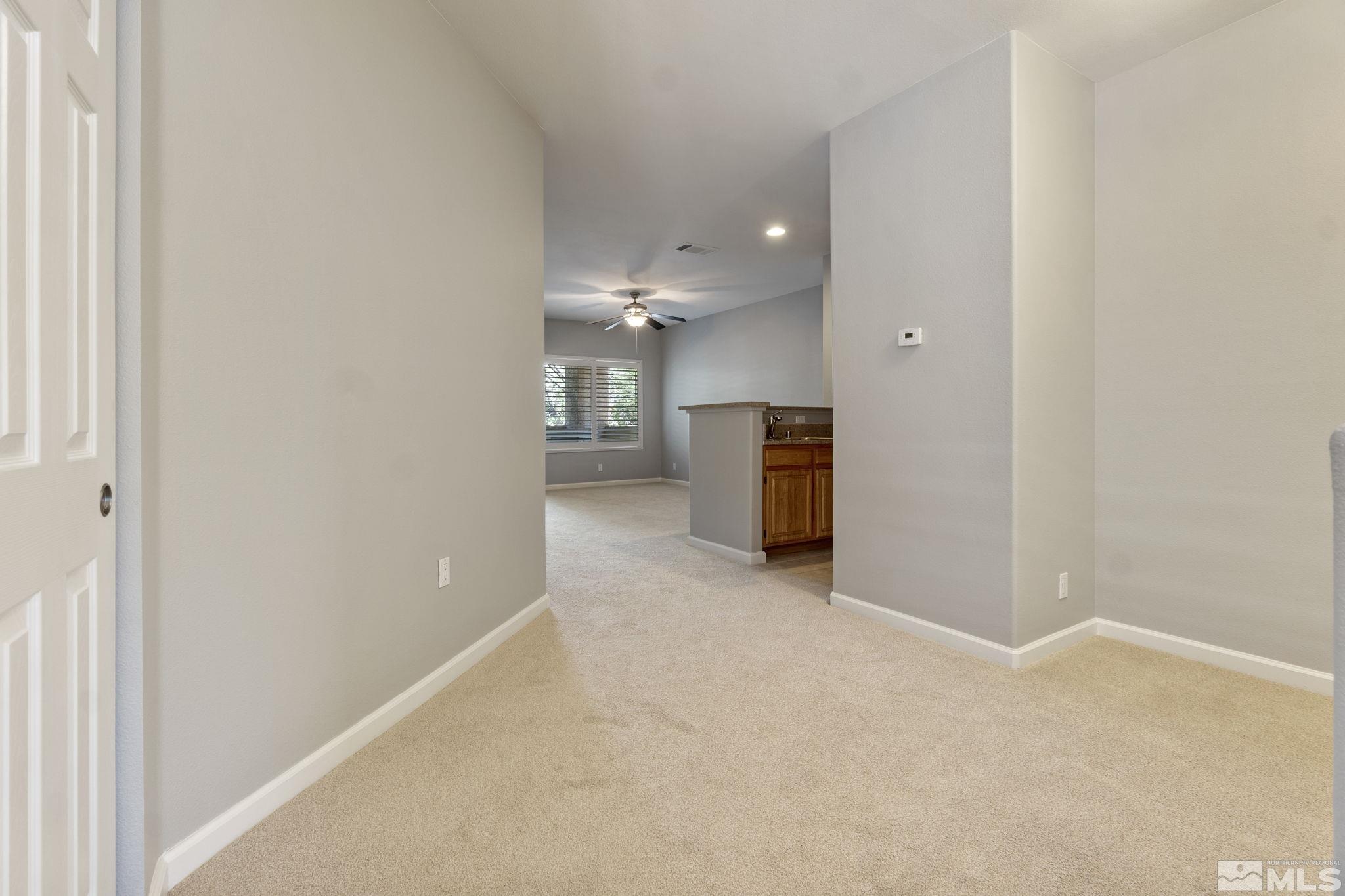 900 South Meadows Parkway, Unit 223 Reno, NV 89521 - Photo 6 of 40 a view of empty room with a fireplace