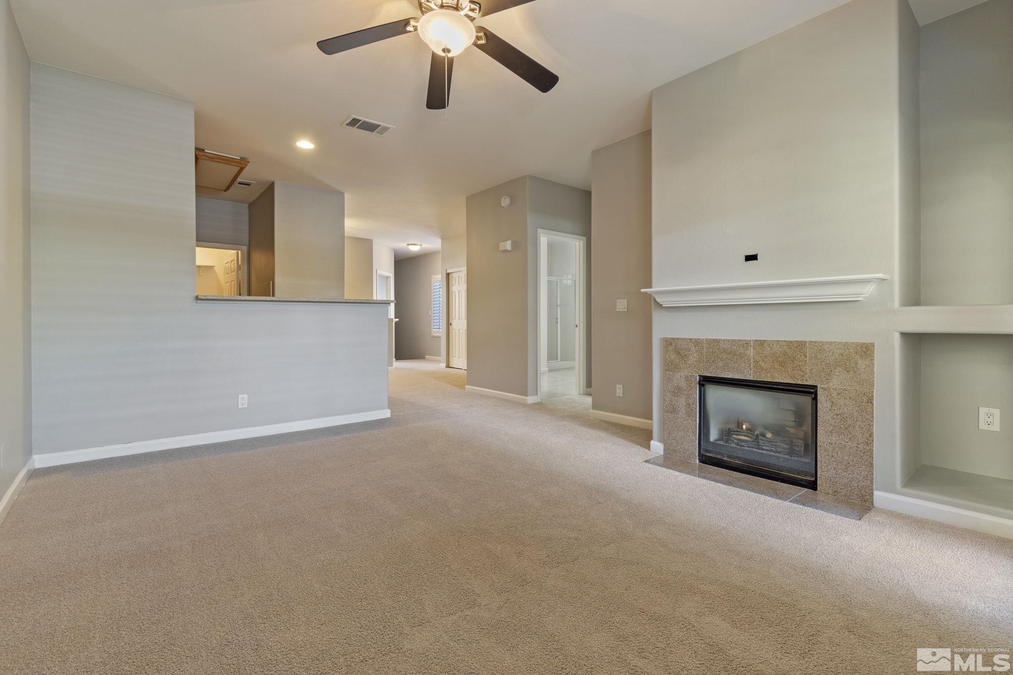 900 South Meadows Parkway, Unit 223 Reno, NV 89521 - Photo 10 of 40 a view of an empty room with a fireplace