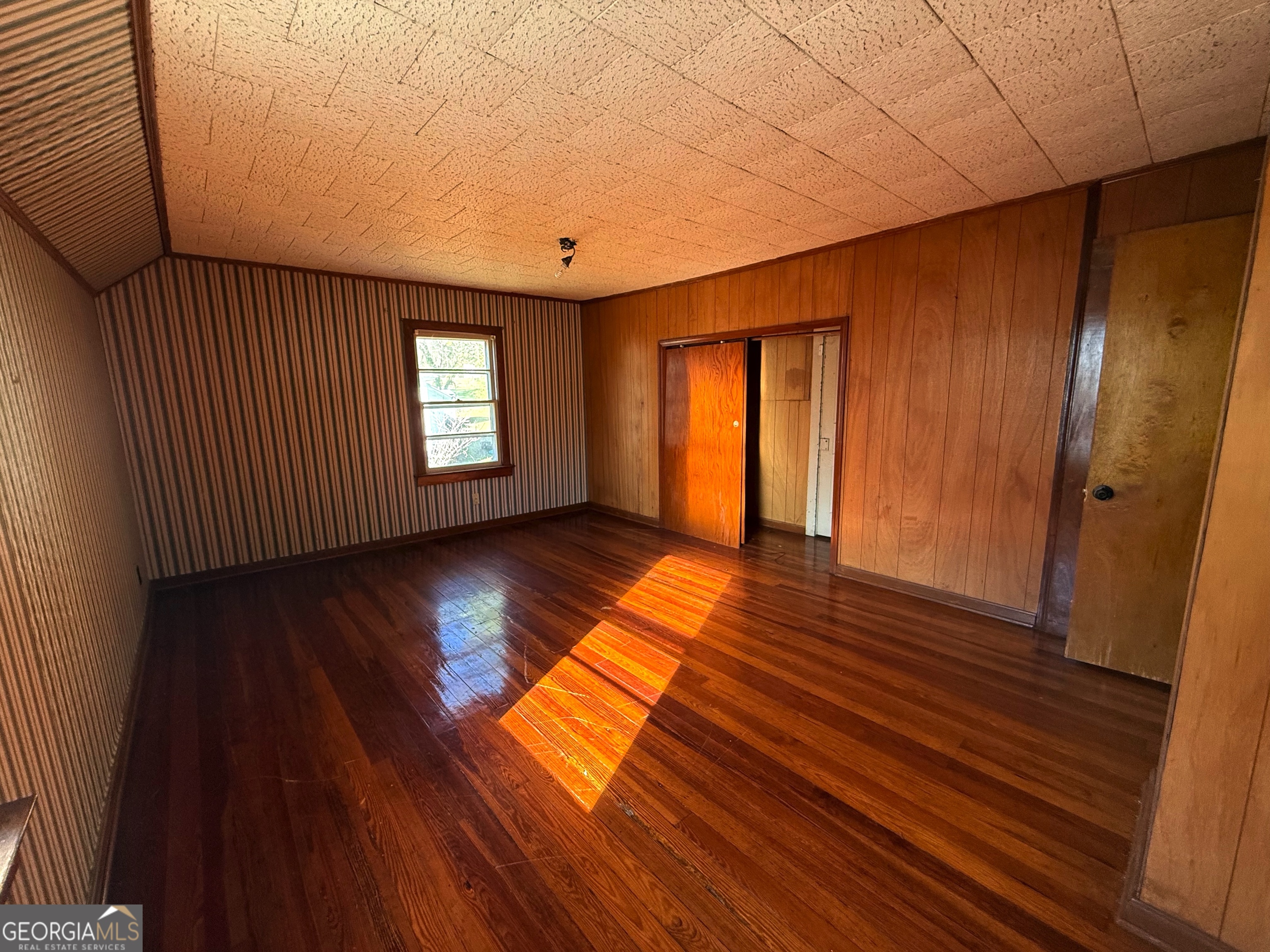 3 Liberty Street Gainesville, GA 30501 - Photo 7 of 8 a view of empty room with wooden floor and fan