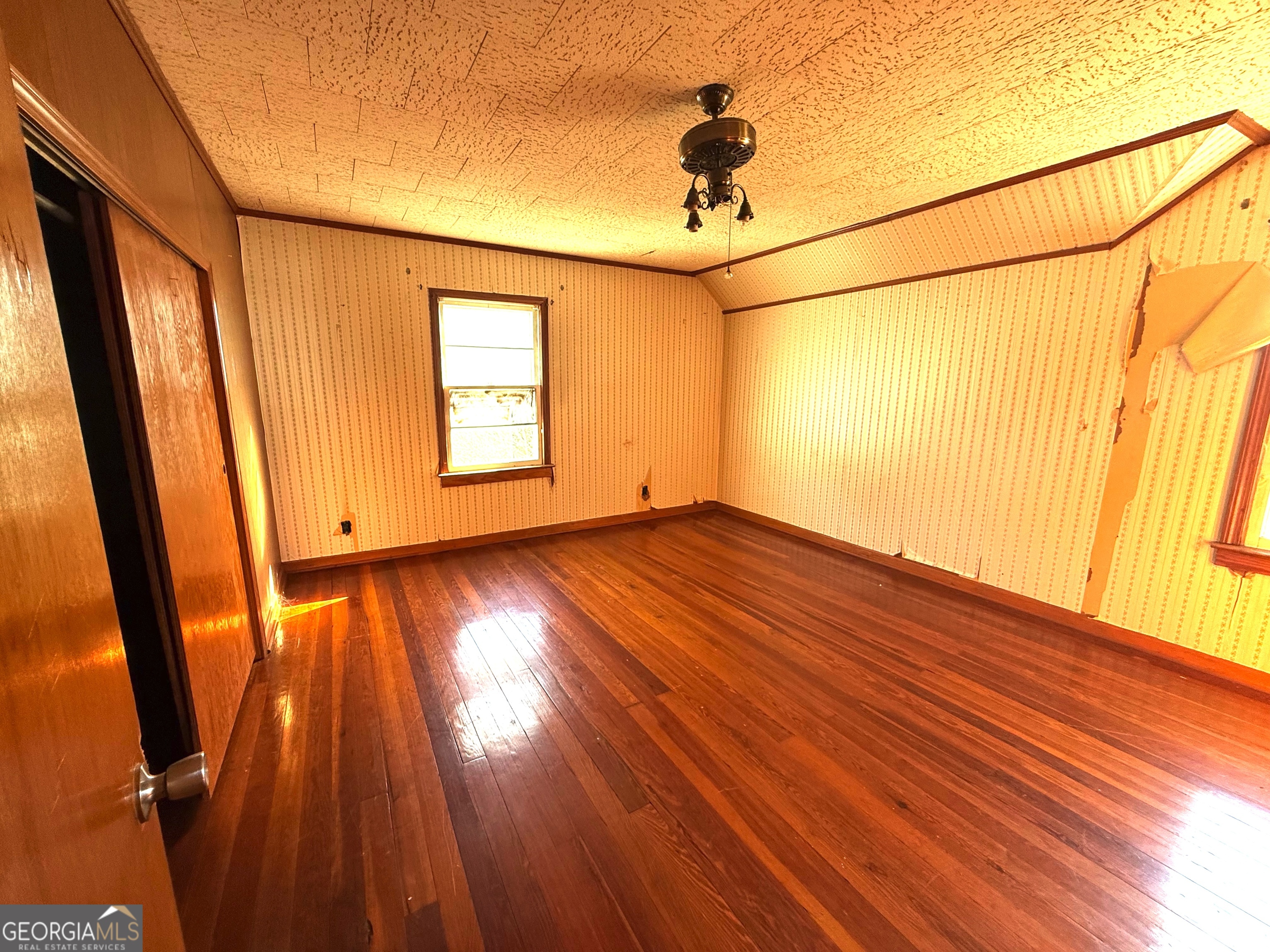 3 Liberty Street Gainesville, GA 30501 - Photo 8 of 8 a view of empty room with wooden floor and fan