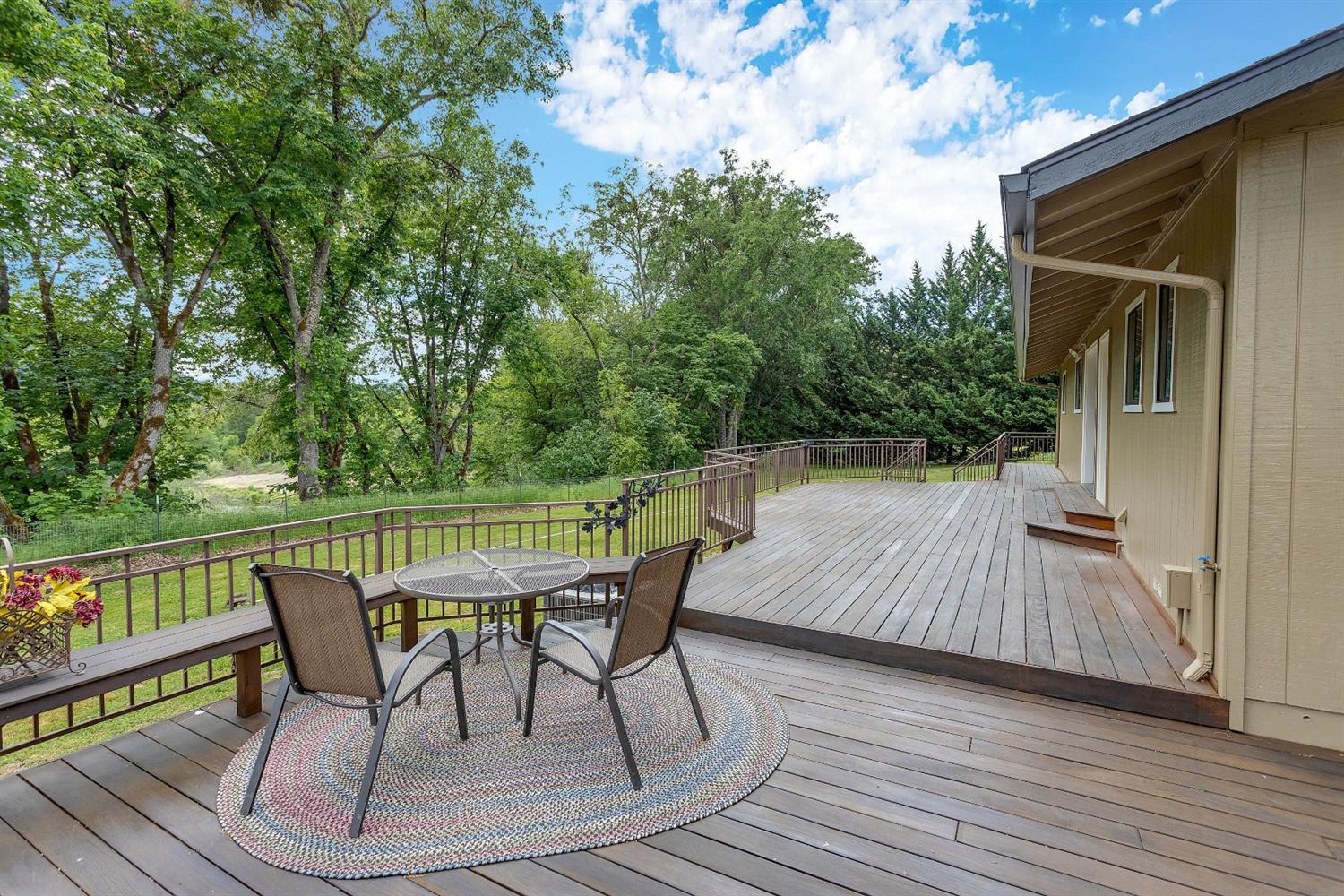 9155 North Applegate Road Grants Pass, OR 97527 - Photo 26 of 35 a patio with wooden floor and outdoor seating