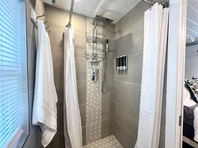 a bathroom with a shower and a toilet