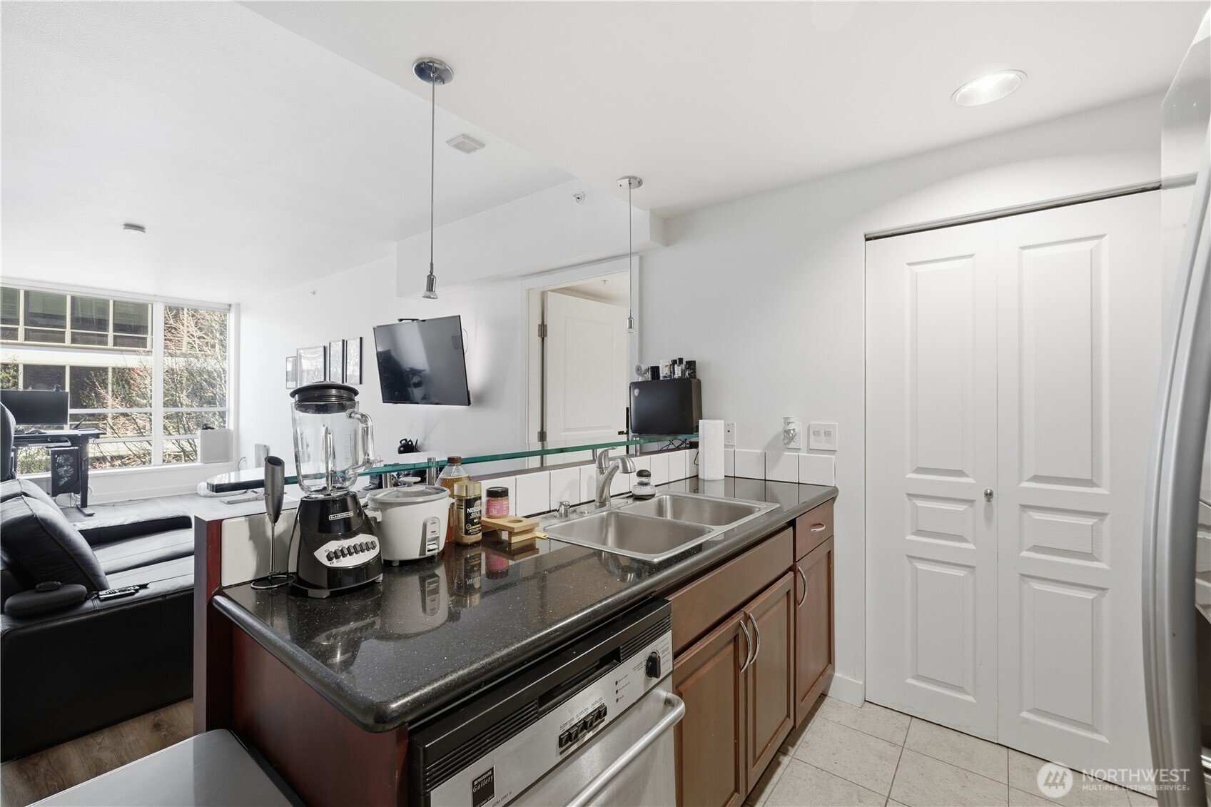 2929 1st Avenue, Unit 201 Seattle, WA 98121 - Photo 11 of 35 a kitchen with appliances cabinets and furniture