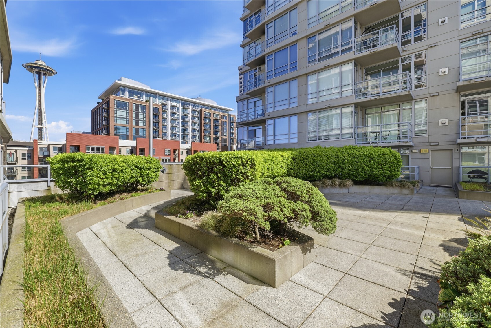2929 1st Avenue, Unit 201 Seattle, WA 98121 - Photo 16 of 35 a view of a building with garden