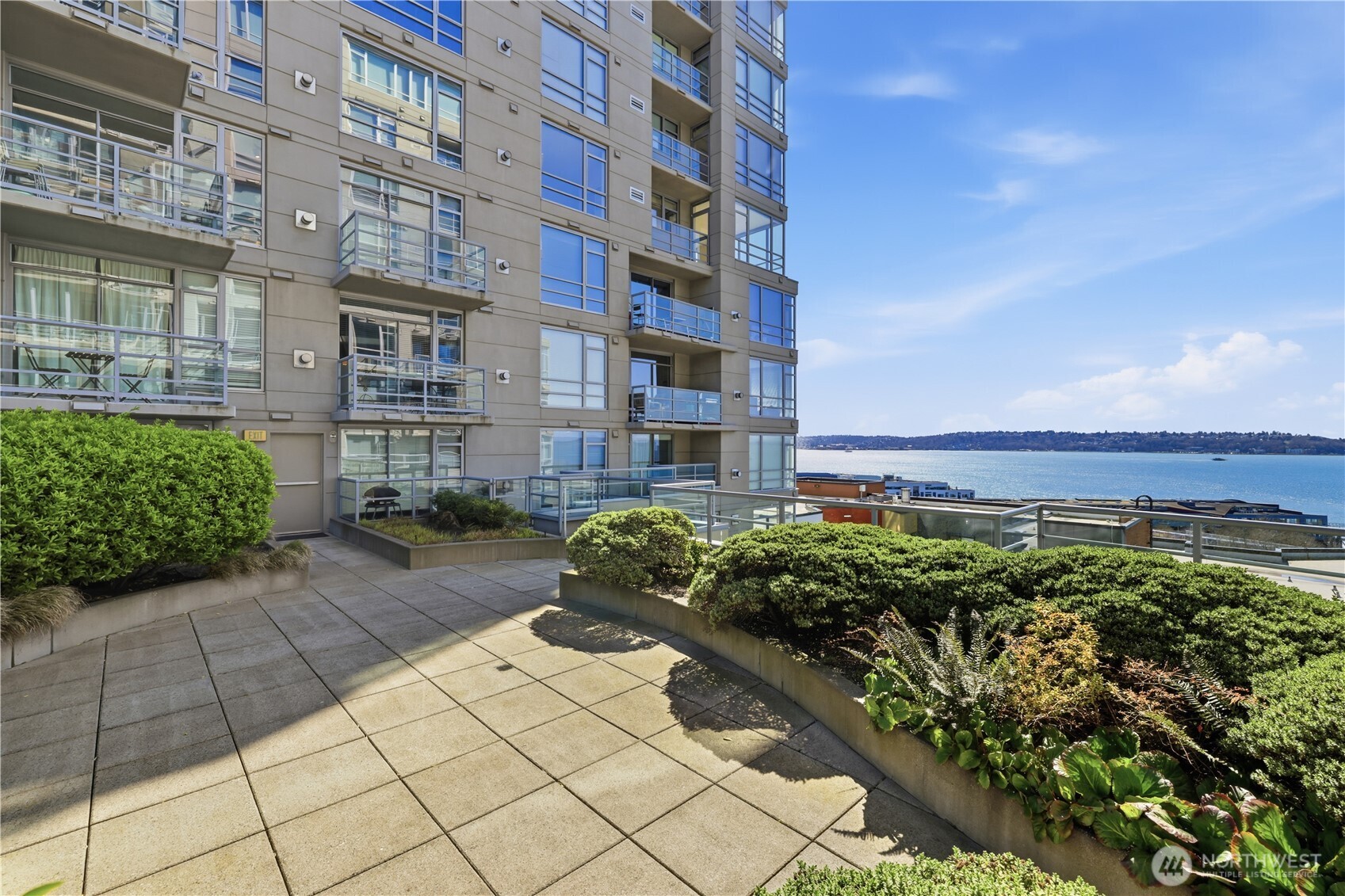 2929 1st Avenue, Unit 201 Seattle, WA 98121 - Photo 22 of 35 a view of a building and a yard