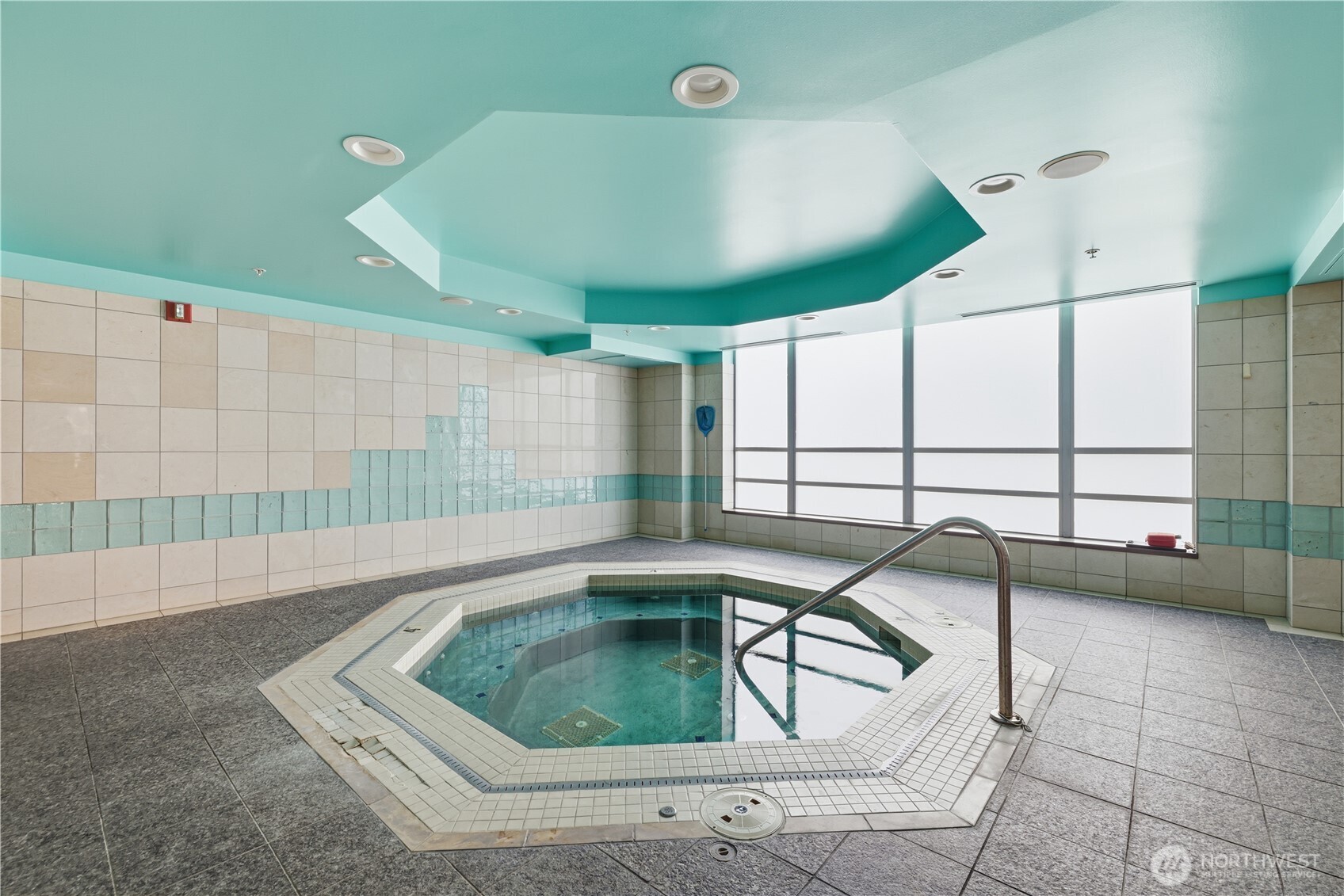2929 1st Avenue, Unit 201 Seattle, WA 98121 - Photo 26 of 35 a swimming pool with outdoor seating and lots of swimming pool