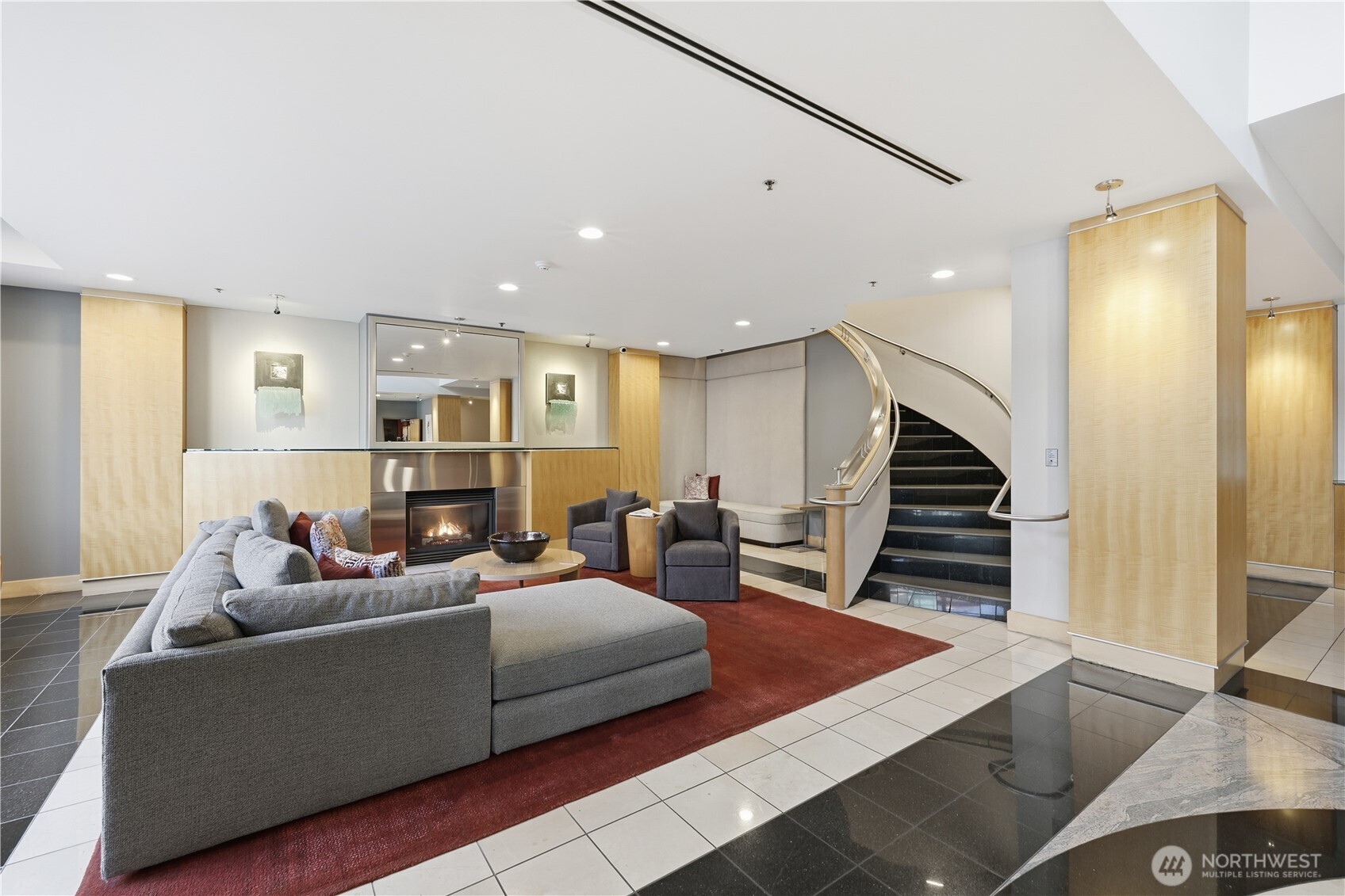 2929 1st Avenue, Unit 201 Seattle, WA 98121 - Photo 34 of 35 a living room with furniture and wooden floor