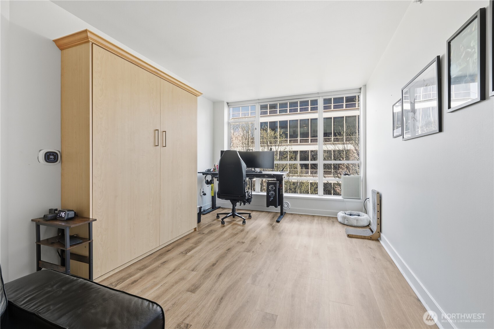 2929 1st Avenue, Unit 201 Seattle, WA 98121 - Photo 5 of 35 a view of a workspace with furniture and a window
