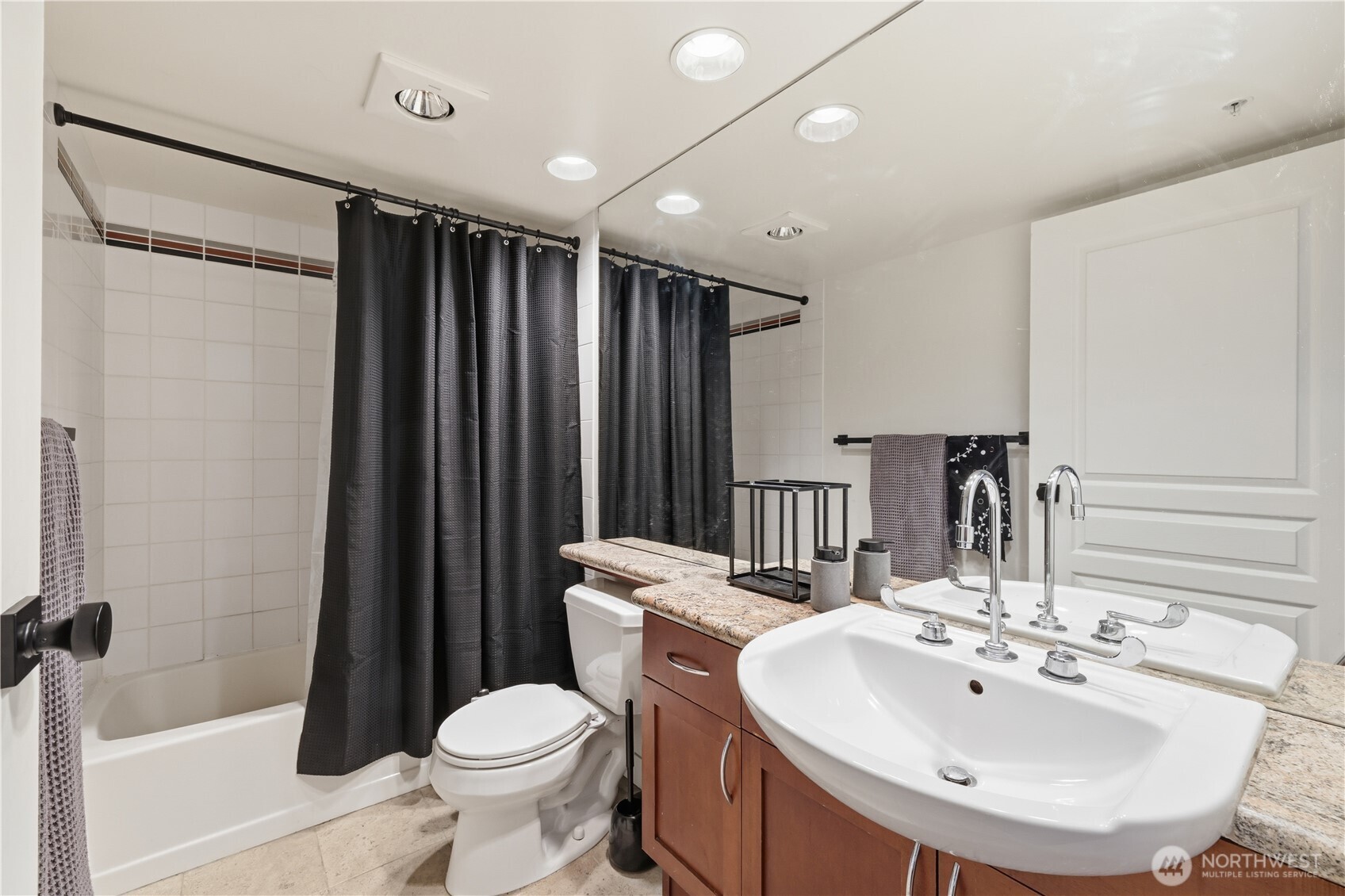 2929 1st Avenue, Unit 201 Seattle, WA 98121 - Photo 10 of 35 a bathroom with a sink toilet and shower