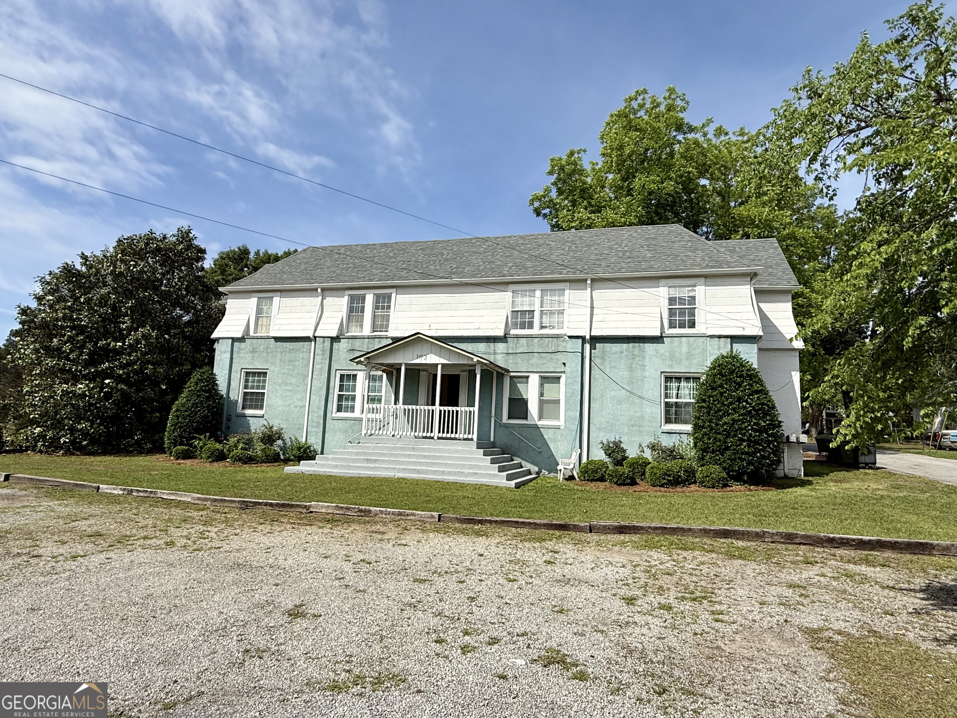 103 Grady Street Thomson, GA 30824 - Photo 1 of 27 a front view of a house with a yard