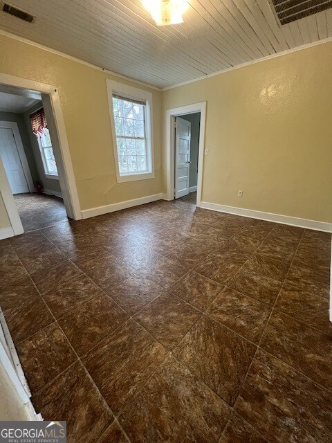 103 Grady Street Thomson, GA 30824 - Photo 22 of 27 a view of an empty room and window