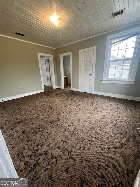 103 Grady Street Thomson, GA 30824 - Photo 24 of 27 en empty room with windows
