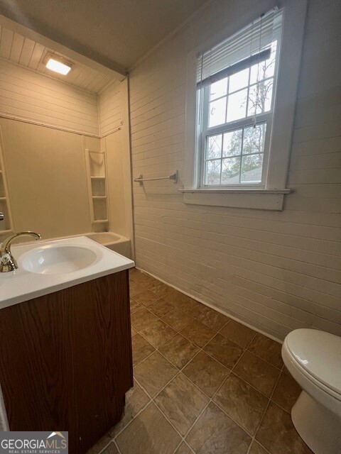 103 Grady Street Thomson, GA 30824 - Photo 25 of 27 a bathroom with a sink toilet and vanity