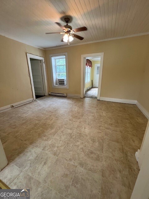 103 Grady Street Thomson, GA 30824 - Photo 3 of 27 a view of an empty room with a window
