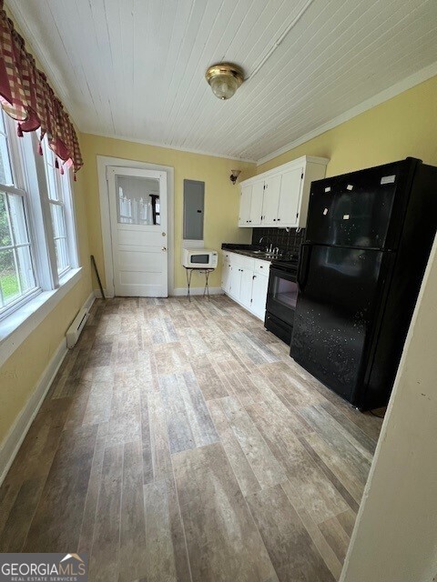 103 Grady Street Thomson, GA 30824 - Photo 4 of 27 a living room with furniture and a wooden floor