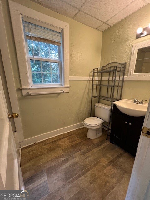 103 Grady Street Thomson, GA 30824 - Photo 6 of 27 a bathroom with a toilet sink and mirror