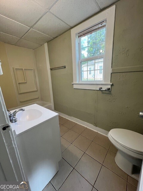 103 Grady Street Thomson, GA 30824 - Photo 8 of 27 a bathroom with a sink toilet and window
