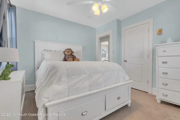 a bedroom with a bed and a cabinets