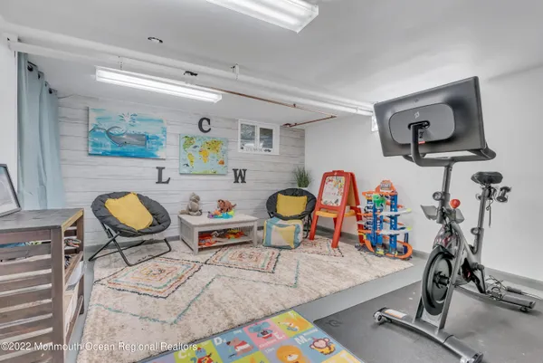 a room with lots of gym equipment