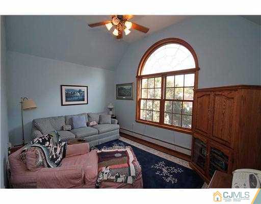 715 Old Raritan Road Edison, NJ 08820 - Photo 11 of 22 a living room with furniture and a window