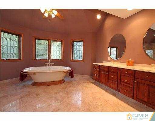 715 Old Raritan Road Edison, NJ 08820 - Photo 13 of 22 a spacious bathroom with a double vanity sink and a mirror
