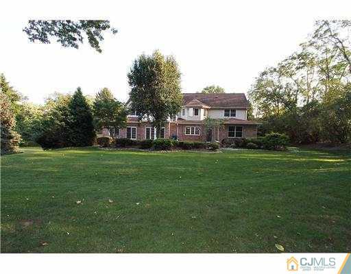 715 Old Raritan Road Edison, NJ 08820 - Photo 22 of 22 a front view of a house with a yard table and trees