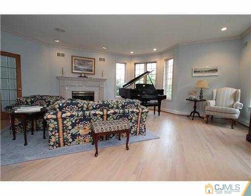 715 Old Raritan Road Edison, NJ 08820 - Photo 4 of 22 a living room with furniture kitchen view and a wooden floor