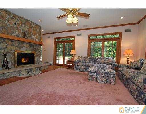 715 Old Raritan Road Edison, NJ 08820 - Photo 9 of 22 a living room with furniture and a fireplace
