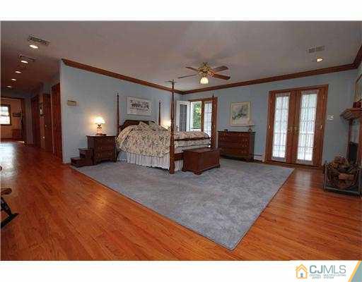 715 Old Raritan Road Edison, NJ 08820 - Photo 10 of 22 a living room with furniture and a fireplace